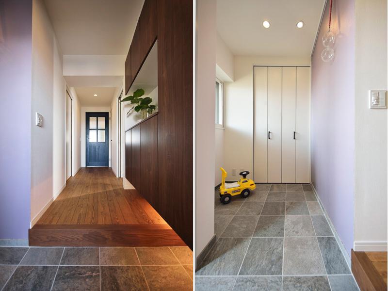 石の質感と優しい紫壁が調和する優雅な玄関です。自転車も入るシューズクロークをご用意。折戸収納や天井高いっぱいの収納をセンスよくまとめ空間を有効利用しました。