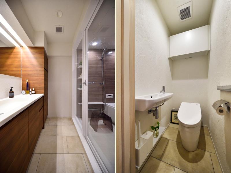 上品で洗練された装いの洗面室・トイレです。限られた空間をより広く感じるよう浴室は全面ガラス、トイレはタンクレスを採用しました。面を上手に使って収納家具をご用意。