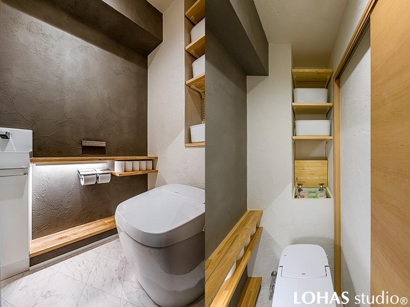 スタイリッシュなレストルーム。棚下には間接照明を設け、壁にはアクセントカラーにグレーの珪藻土を施工。カッコいいだけじゃなく、消臭効果も期待できるスグレモノ。パイプスペースとのわずかな隙間も収納スペースに。フタを開けるスタイルなのでお子さまも出し入れもしやすい設計に。